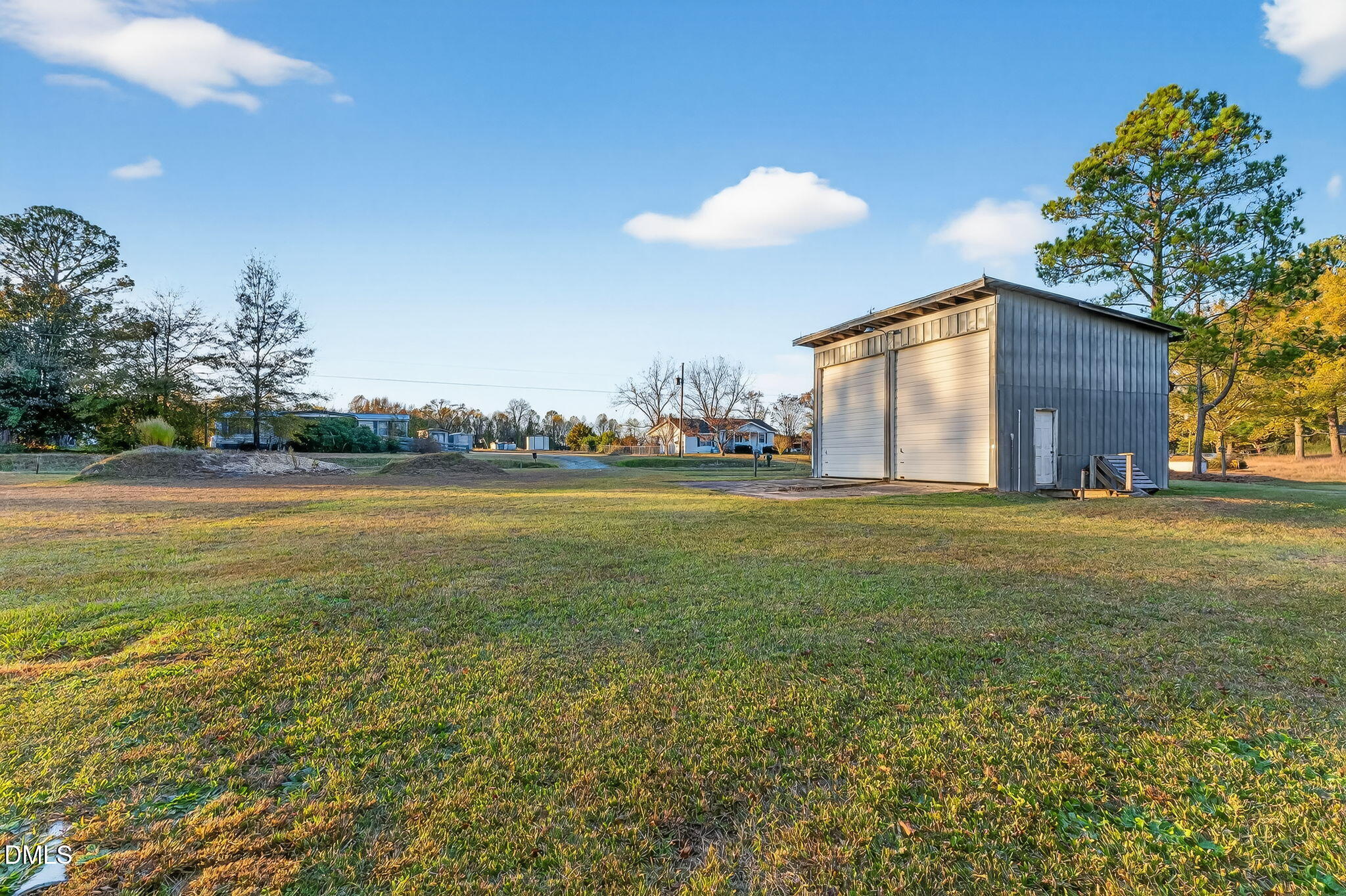 0 Steven's Chapel Road Smithfield, NC 27577 - Photo 3 of 11 a view of a house with a yard and a large tree