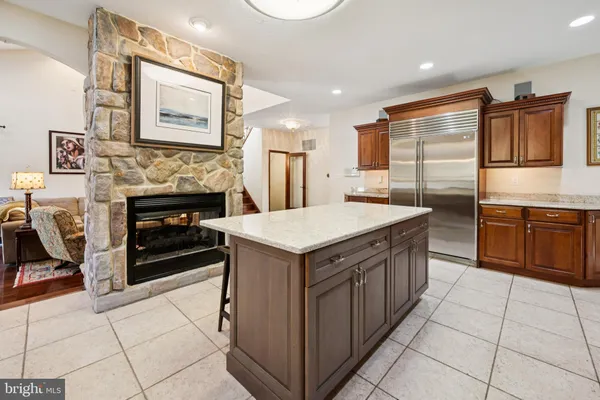 a kitchen with stainless steel appliances granite countertop a stove and a refrigerator