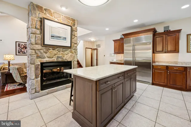 a kitchen with stainless steel appliances granite countertop a stove and a refrigerator