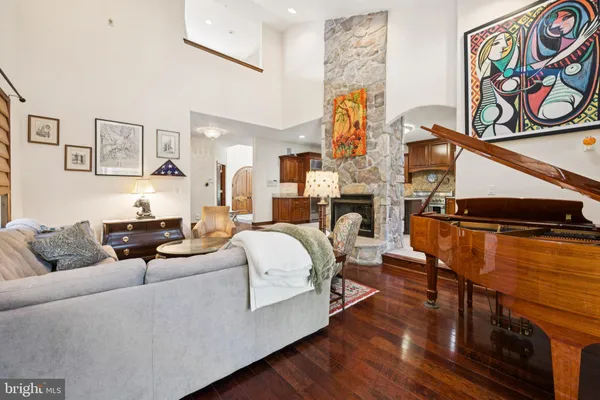 a living room with furniture and painting on the wall