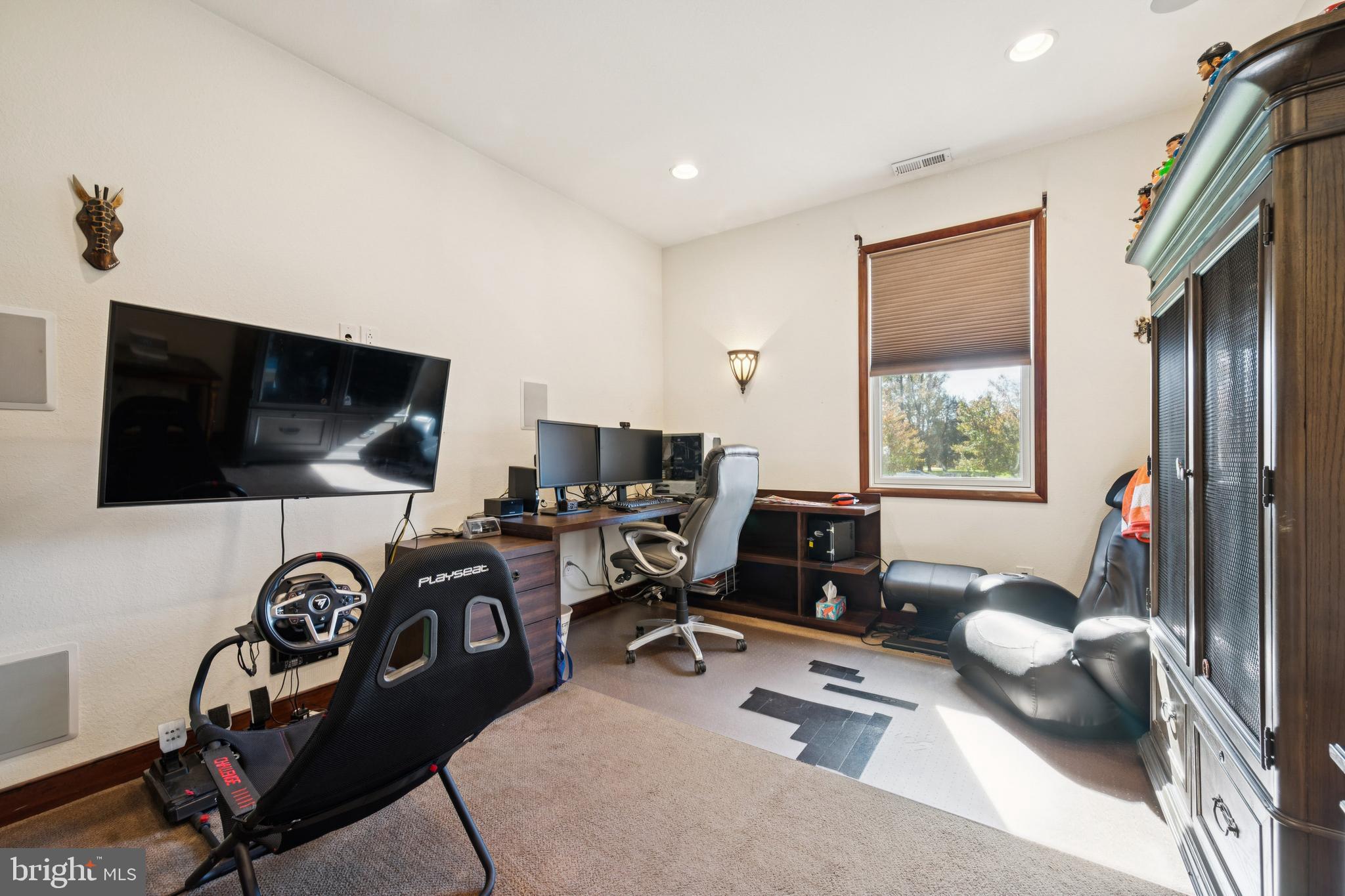 18 Lansbrook Court Sewell, NJ 08080 - Photo 17 of 44 a workspace with a flat screen tv and a large window