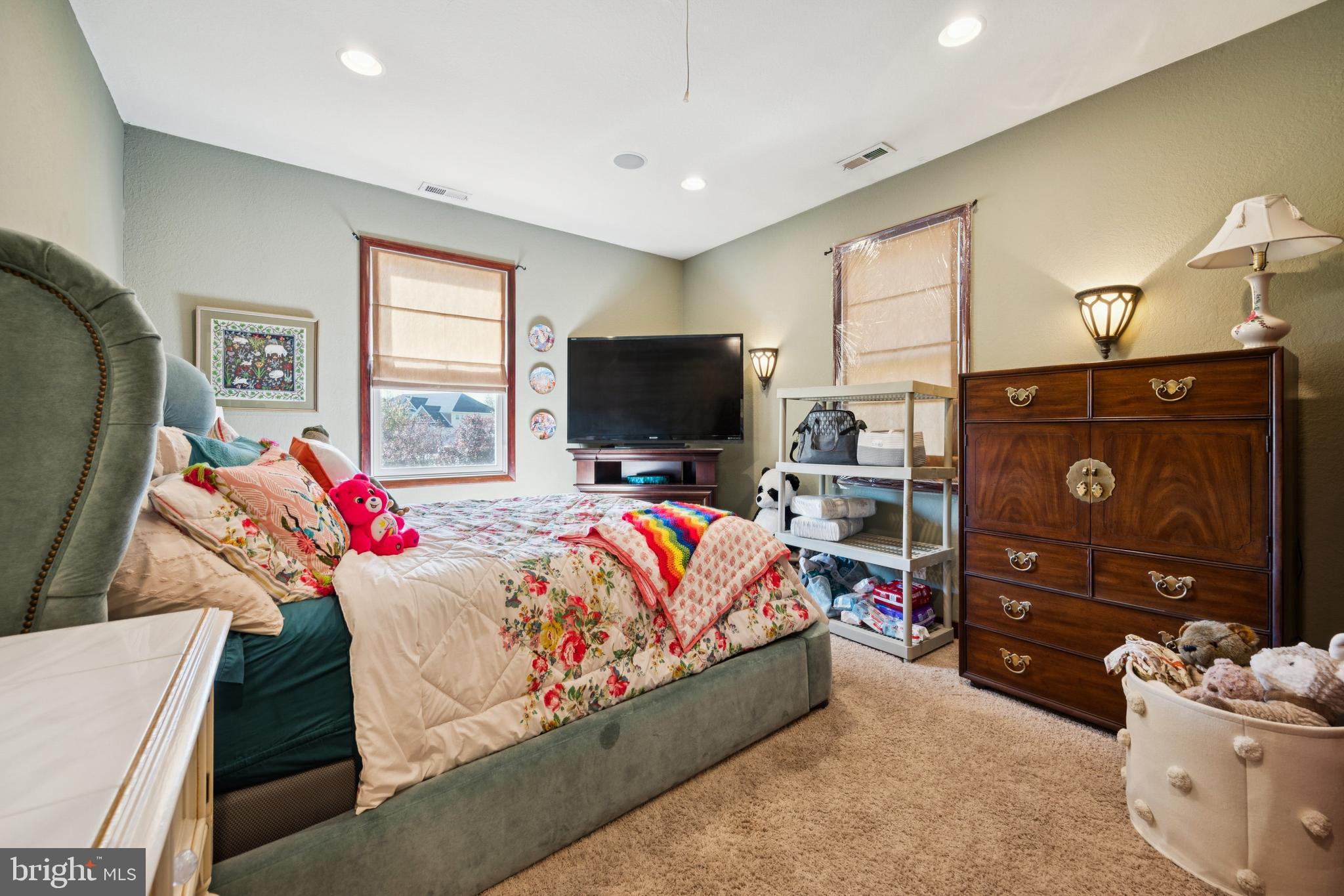 18 Lansbrook Court Sewell, NJ 08080 - Photo 18 of 44 a living room with a couch and a flat screen tv