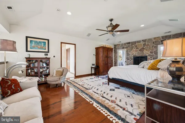 a living room with furniture fireplace and a flat screen tv