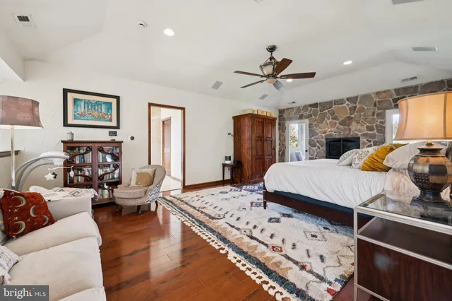 a living room with furniture fireplace and a flat screen tv
