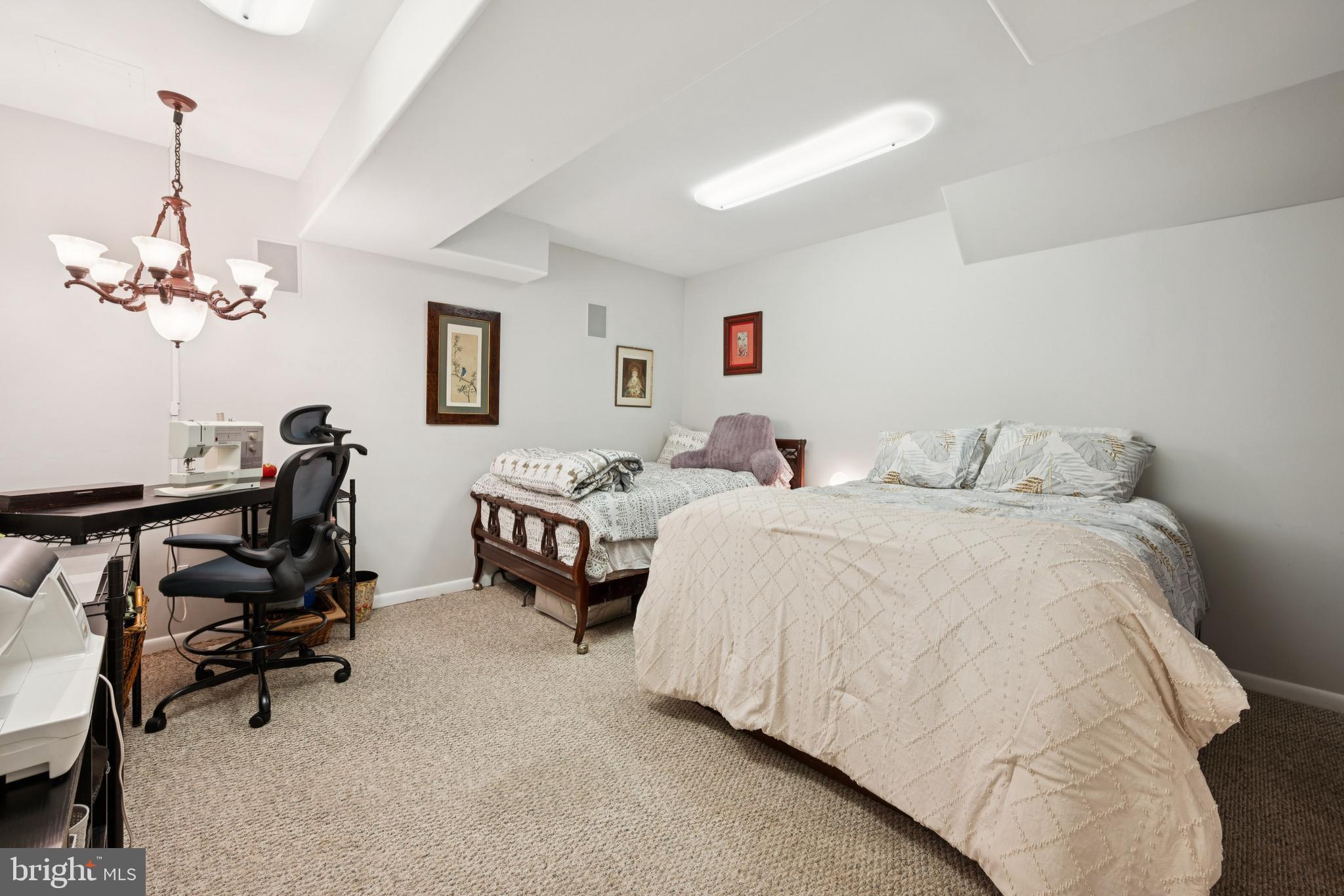 18 Lansbrook Court Sewell, NJ 08080 - Photo 27 of 44 a bedroom with bed and a chandelier