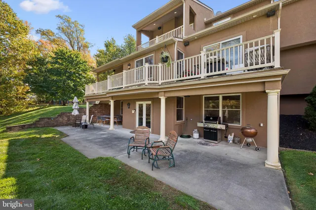 a view of a house with a yard porch and sitting area