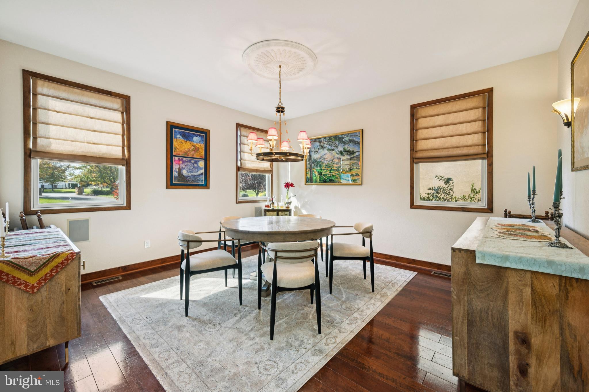 18 Lansbrook Court Sewell, NJ 08080 - Photo 7 of 44 a dining room with wooden floor a chandelier a wooden table and chairs