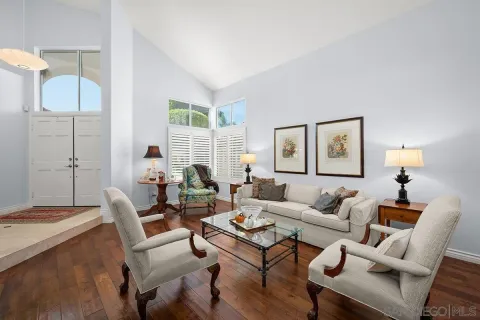 a living room with furniture and a table