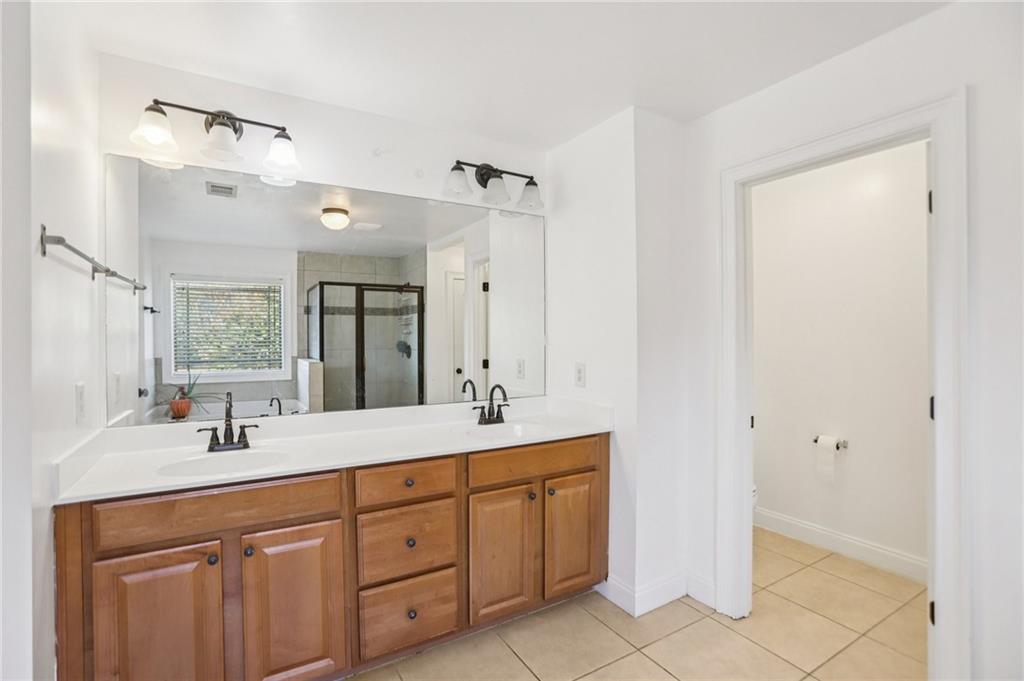 3154 Alhambra Circle Hampton, GA 30228 - Photo 25 of 33 a bathroom with a sink and a mirror