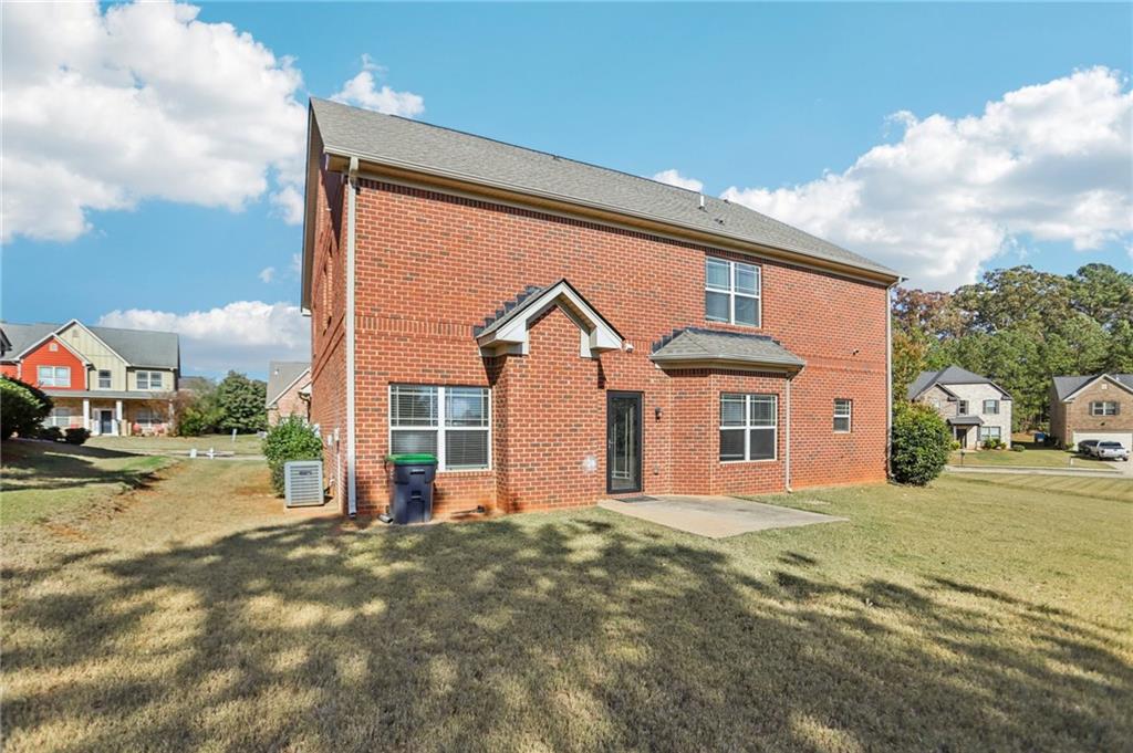 3154 Alhambra Circle Hampton, GA 30228 - Photo 29 of 33 a front view of a house with a porch