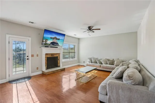 a living room with furniture and a fireplace