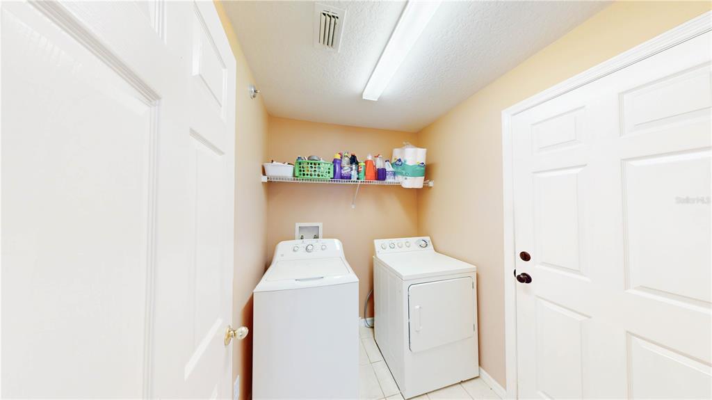 1103 Mallory Point Drive Valrico, FL 33596 - Photo 14 of 21 a utility room with dryer and washer