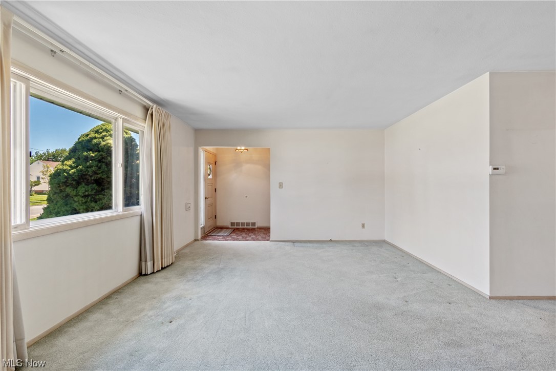 1722 Chelmsford Road Cleveland, OH 44124 - Photo 4 of 34 Empty room with light carpet