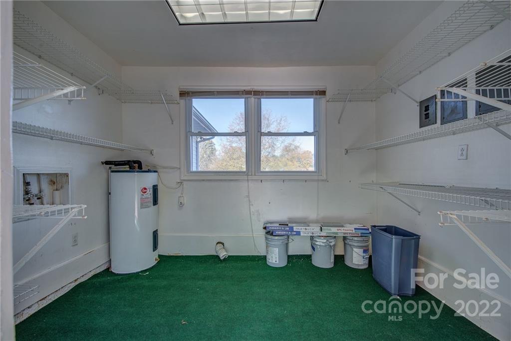 421 Ashebrook Park Road Dallas, NC 28034 - Photo 26 of 28 a room with a washing machine and more cabinets