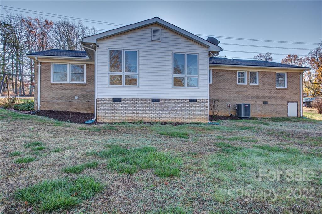 421 Ashebrook Park Road Dallas, NC 28034 - Photo 28 of 28 a view of a house with a yard