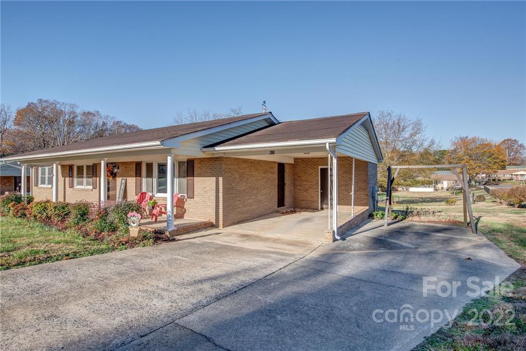 421 Ashebrook Park Road Dallas, NC 28034 - Photo 3 of 28 a front view of a house with garden