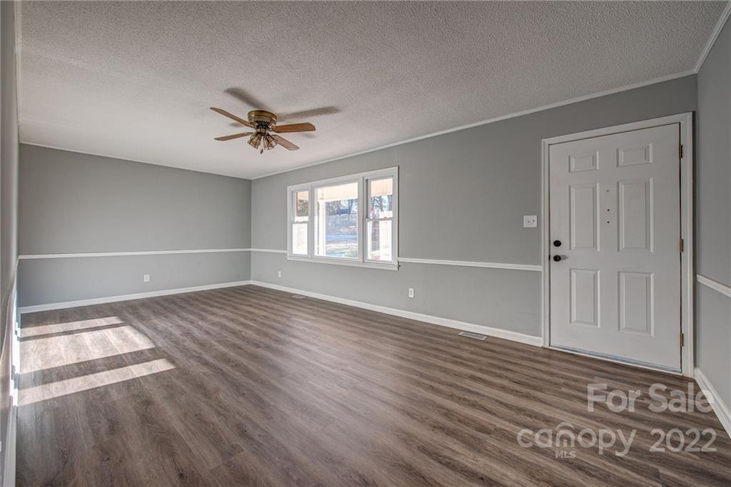 421 Ashebrook Park Road Dallas, NC 28034 - Photo 5 of 28 wooden floor in an empty room with a window