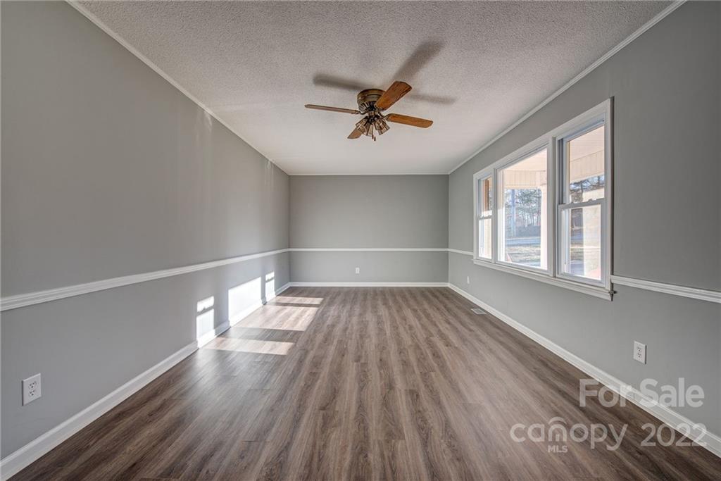 421 Ashebrook Park Road Dallas, NC 28034 - Photo 8 of 28 wooden floor in an empty room with a window