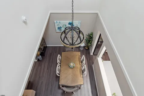 a kitchen with stainless steel appliances a sink cabinets and a window