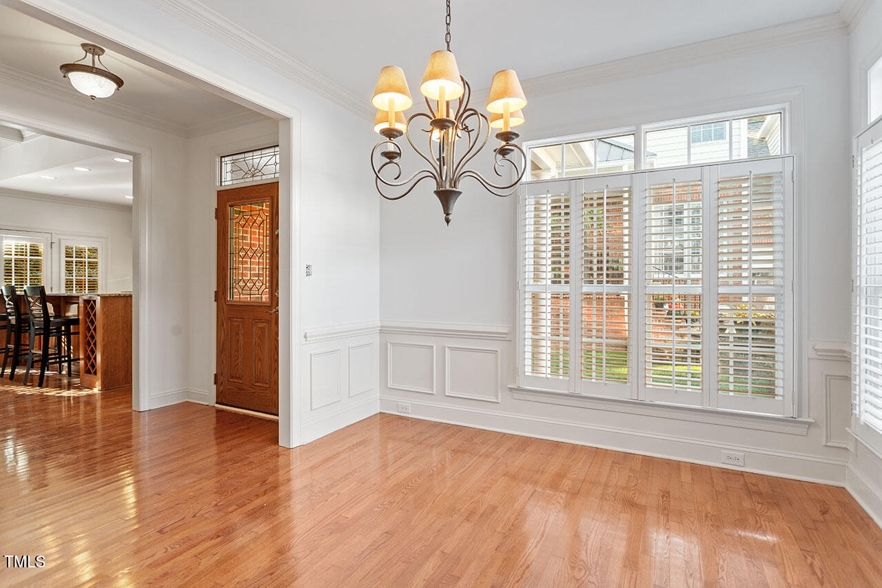 7342 Fontana Ridge Lane Raleigh, NC 27613 - Photo 11 of 26 a view of an empty room with window and wooden floor
