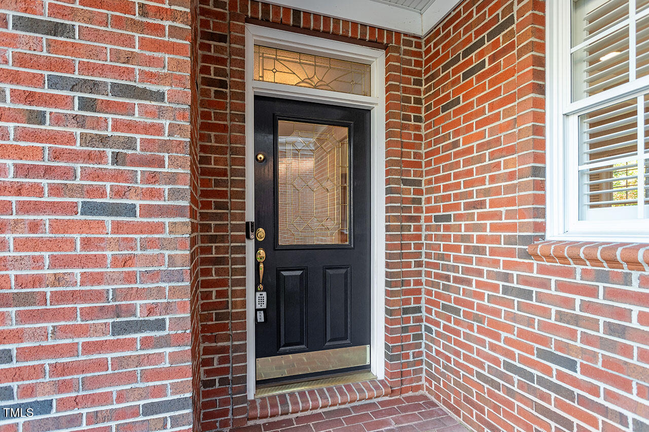 7342 Fontana Ridge Lane Raleigh, NC 27613 - Photo 2 of 26 a view of a brick wall