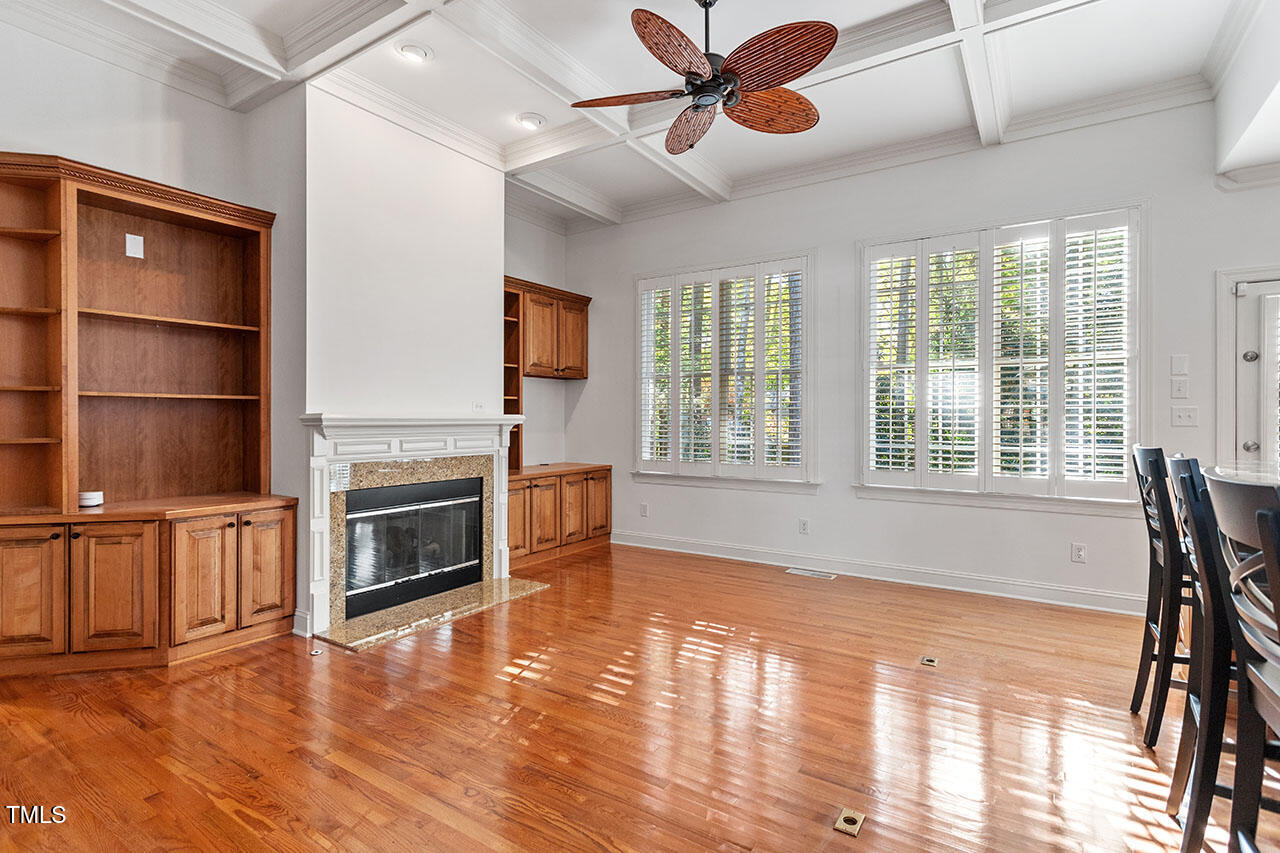 7342 Fontana Ridge Lane Raleigh, NC 27613 - Photo 3 of 26 a view of a livingroom with furniture wooden floor window and fireplace