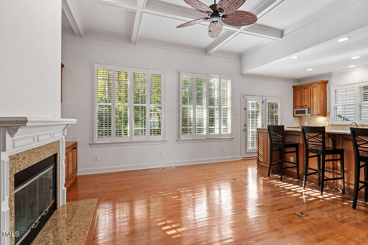7342 Fontana Ridge Lane Raleigh, NC 27613 - Photo 4 of 26 a view of a dining room with furniture window and wooden floor