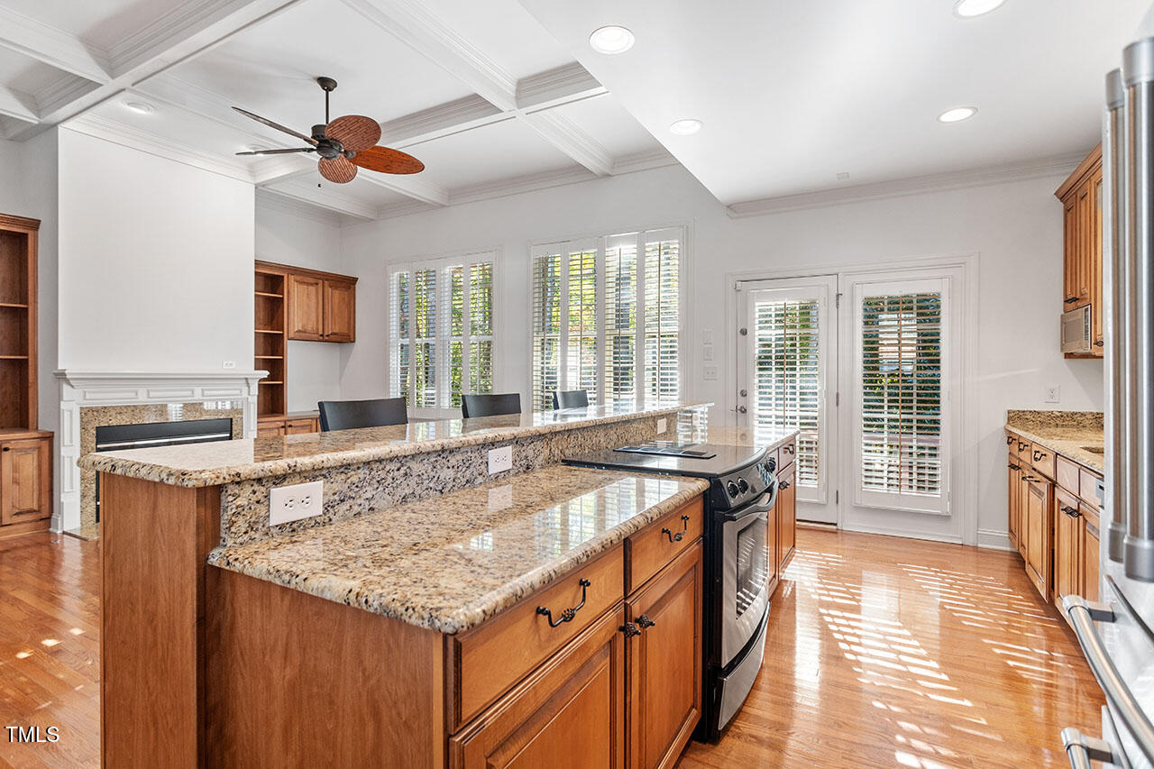 7342 Fontana Ridge Lane Raleigh, NC 27613 - Photo 8 of 26 a kitchen with stainless steel appliances granite countertop a stove and a sink
