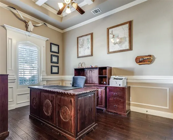 a view of a kitchen with furniture and windows