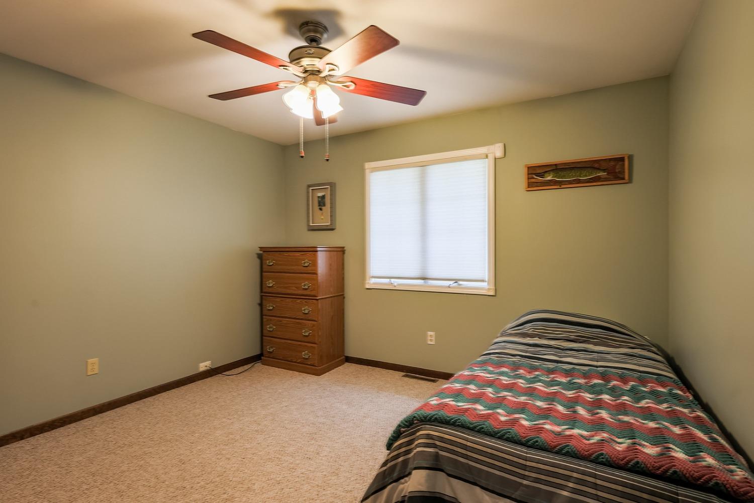 2419 Flat Rock Road Dyer, IN 46311 - Photo 11 of 21 a bedroom with a bed and a chandelier