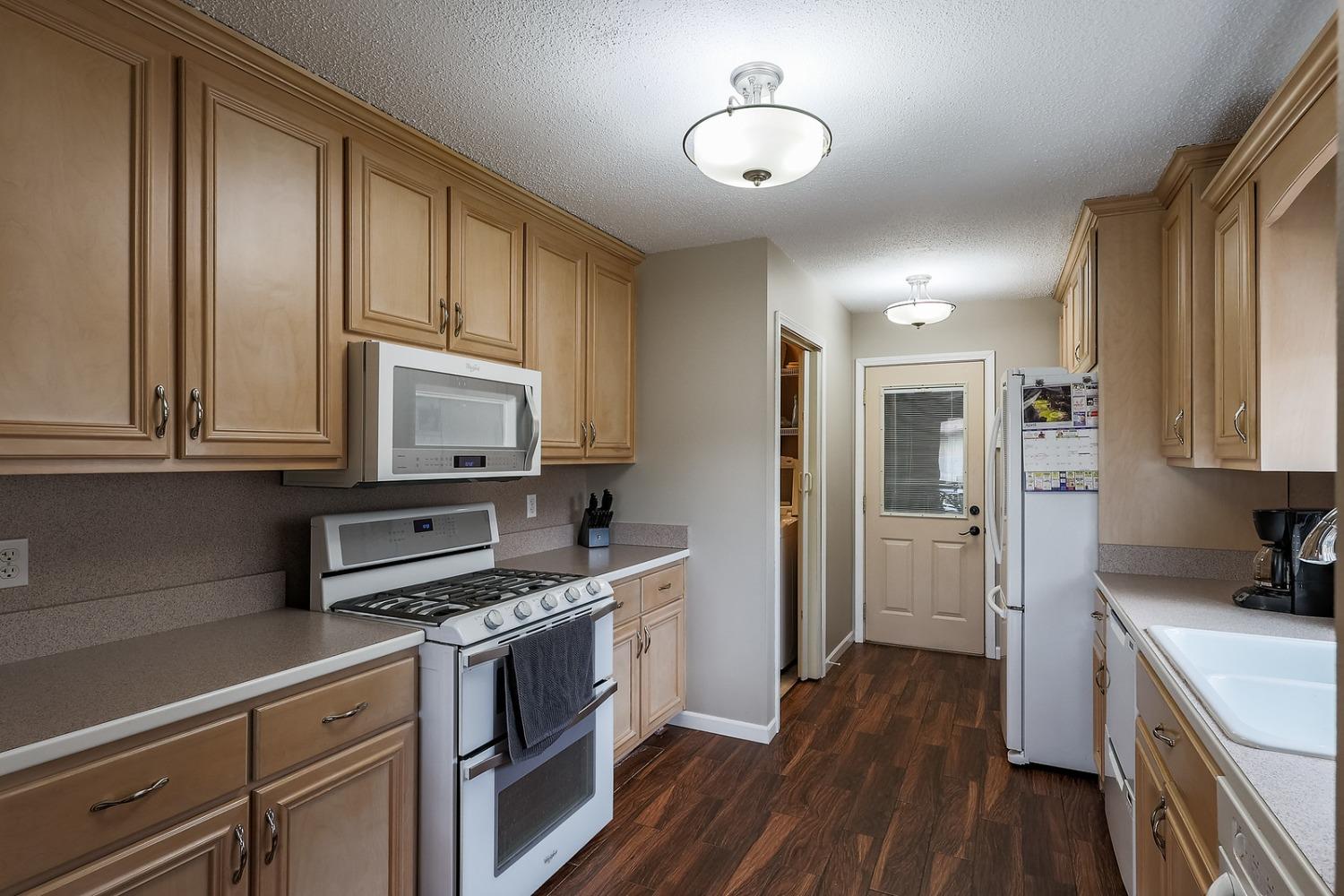 2419 Flat Rock Road Dyer, IN 46311 - Photo 7 of 21 a kitchen with stainless steel appliances a stove cabinets and wooden floor