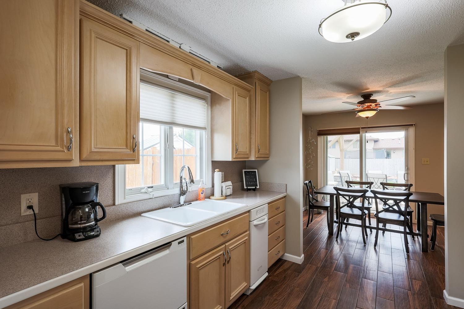 2419 Flat Rock Road Dyer, IN 46311 - Photo 8 of 21 a kitchen with a table chairs stove and cabinets