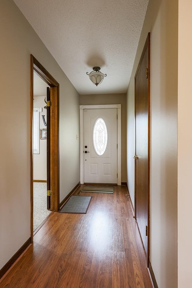 2419 Flat Rock Road Dyer, IN 46311 - Photo 9 of 21 an empty room with wooden floor and windows