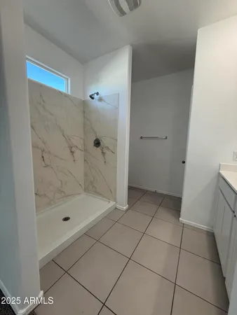 a bathroom with a double vanity sink and mirror