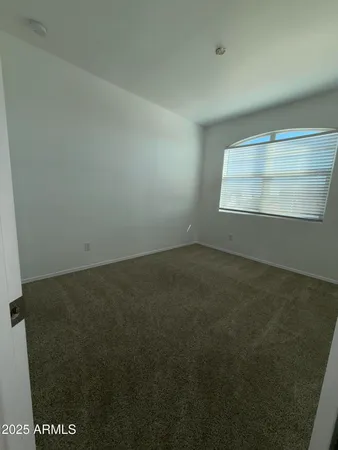 a view of a hallway to rooms