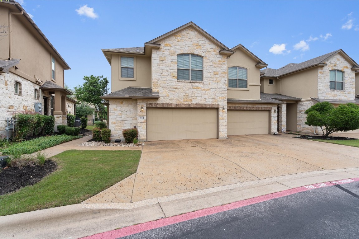 14001 Avery Ranch Boulevard, Unit 2801 Austin, TX 78717 - Photo 1 of 1 a front view of a house with a yard and garage