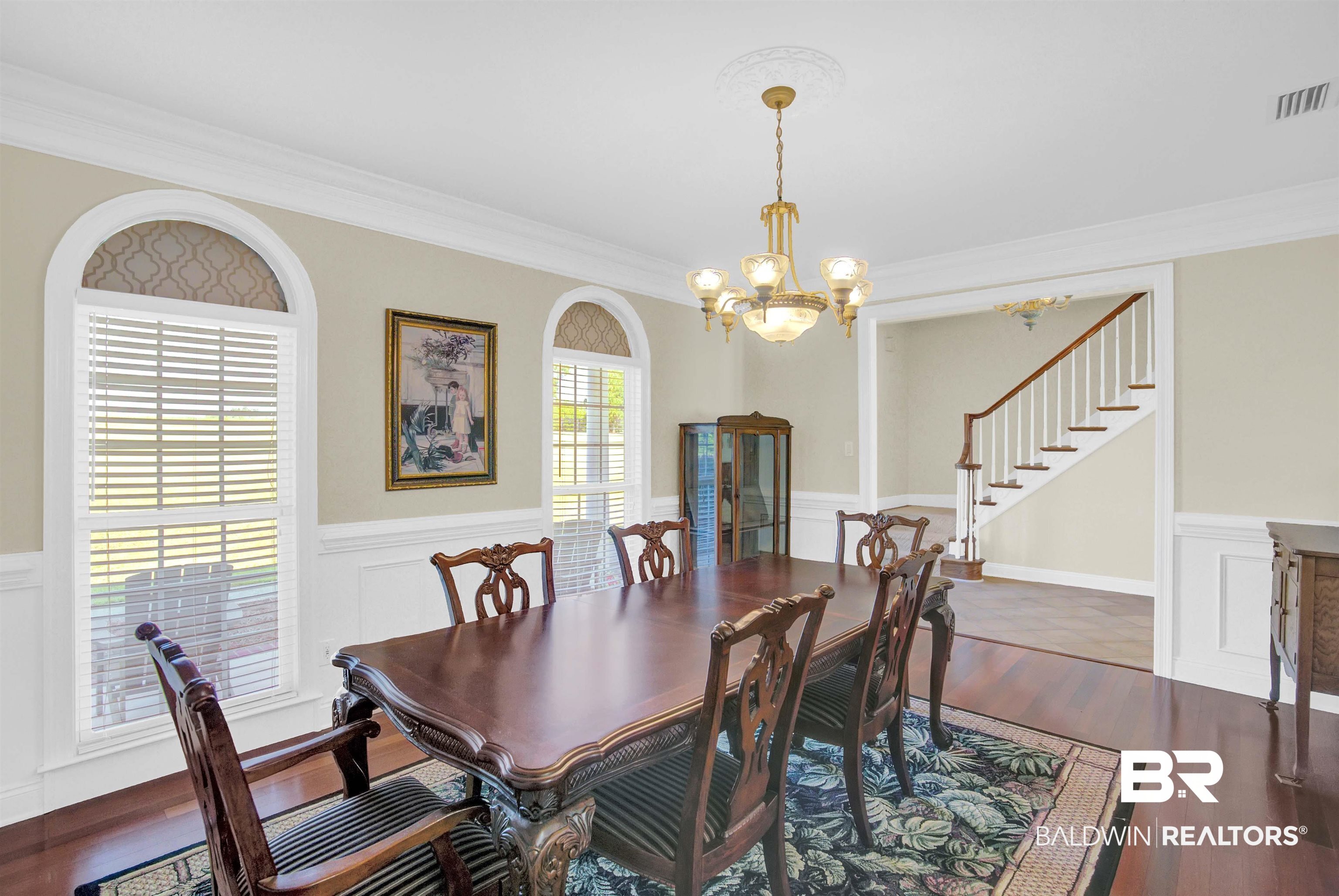 27688 Rigsby Road Daphne, AL 36526 - Photo 11 of 56 Dining room featuring a notable chandelier, ornamental molding, and hardwood / wood-style floors