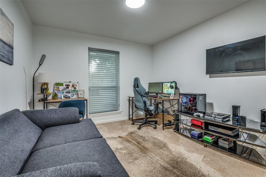 11211 McCree Road Dallas, TX 75238 - Photo 15 of 29 a living room with furniture and a flat screen tv