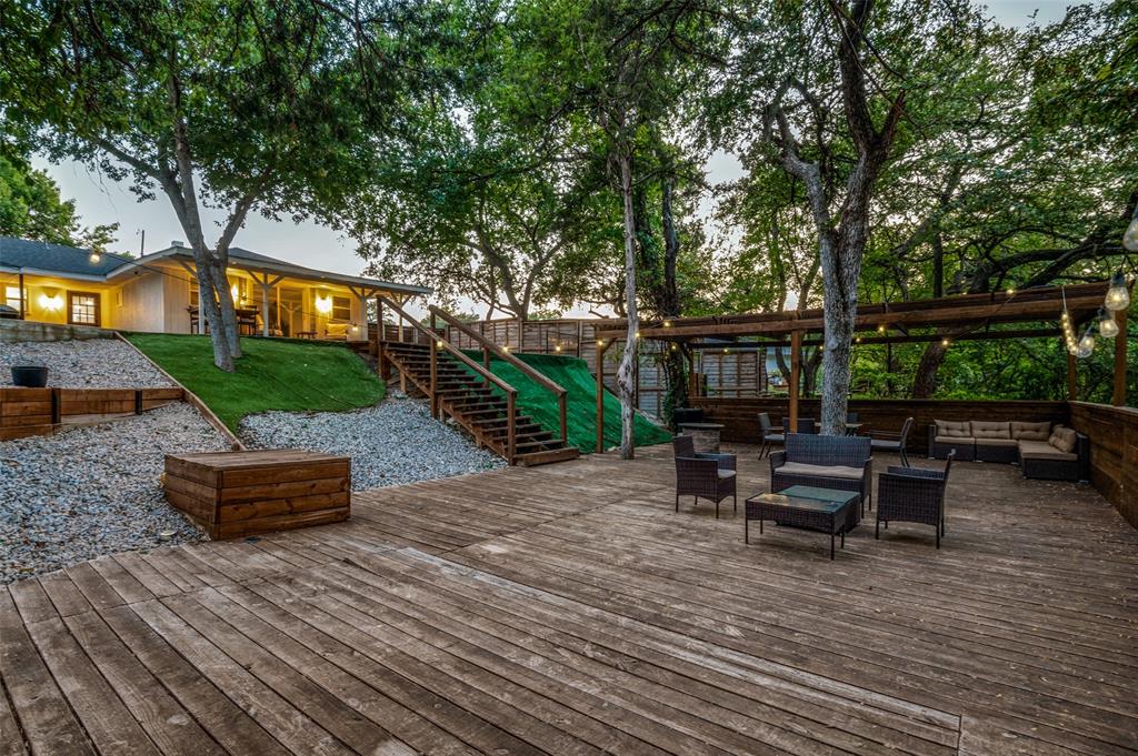 11211 McCree Road Dallas, TX 75238 - Photo 23 of 29 a front view of a house with garden and sitting area