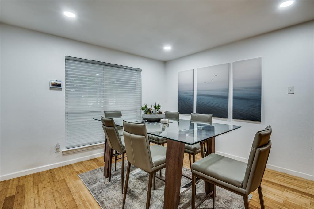 11211 McCree Road Dallas, TX 75238 - Photo 6 of 29 a view of a dining room with furniture and wooden floor