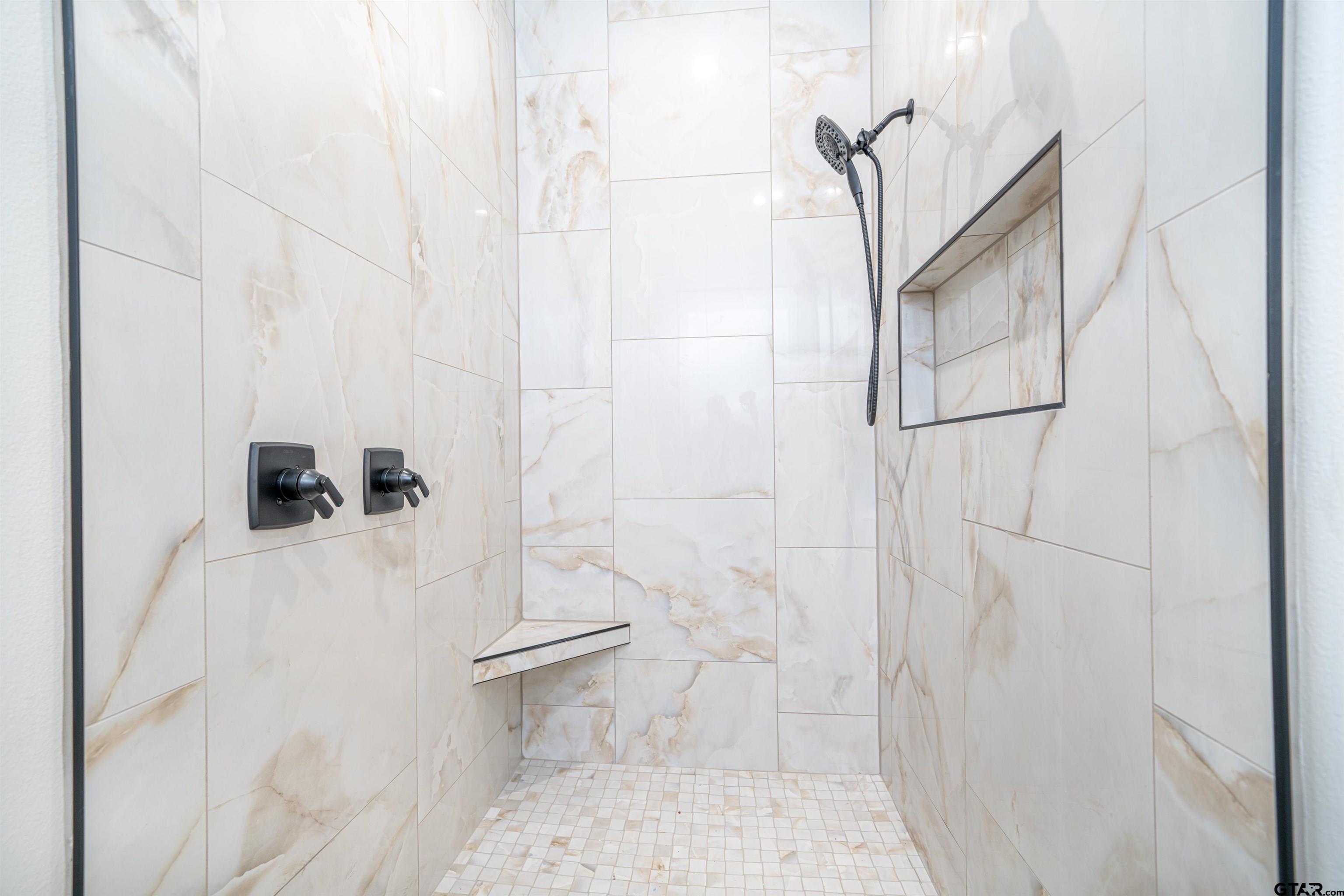 3910 Hidden Hills Circle Longview, TX 75605 - Photo 18 of 39 a bathroom with a shower