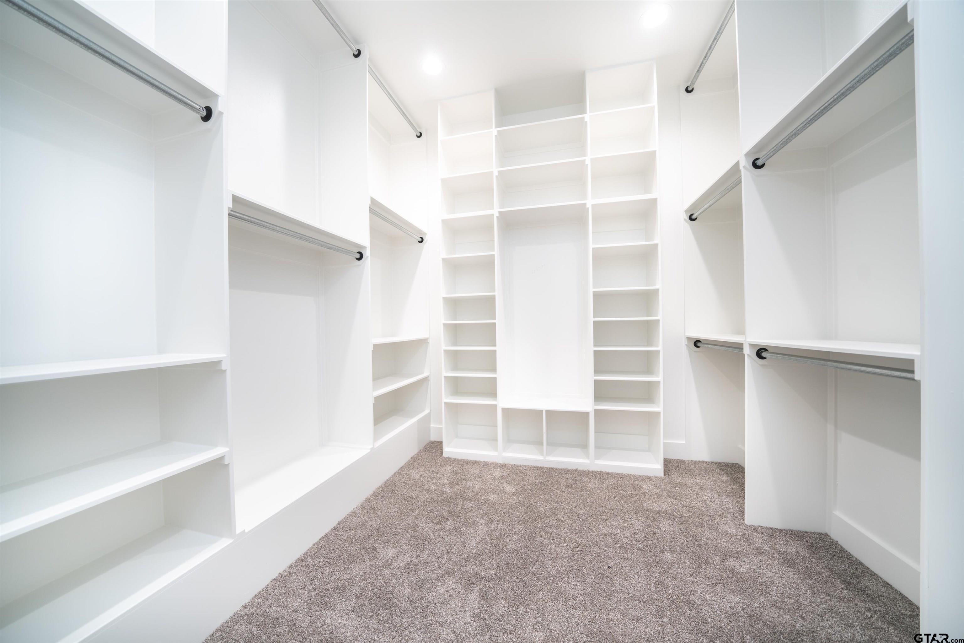 3910 Hidden Hills Circle Longview, TX 75605 - Photo 19 of 39 a view of walk in closet with empty racks
