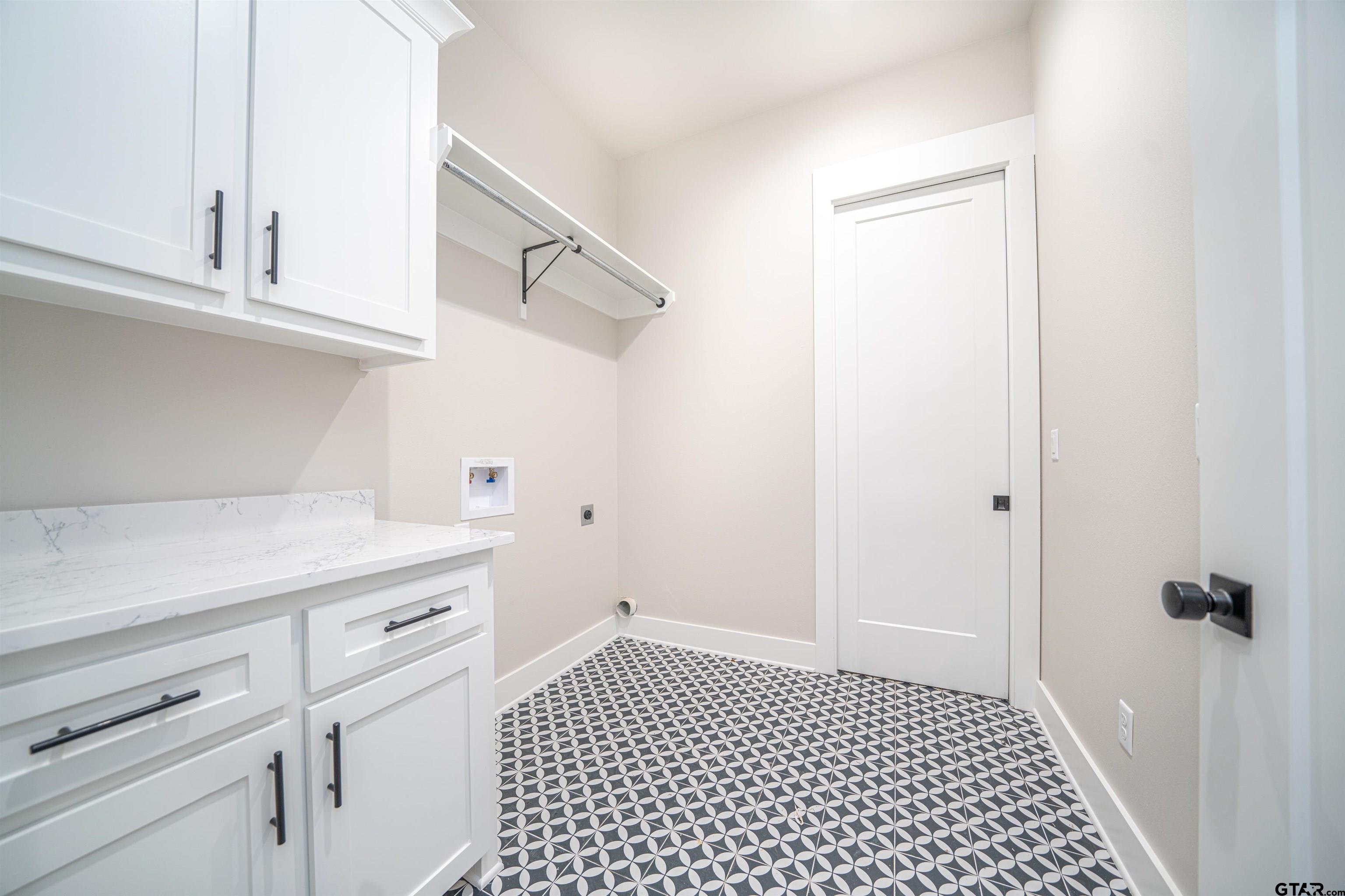 3910 Hidden Hills Circle Longview, TX 75605 - Photo 21 of 39 a bathroom with a sink and a cabinets