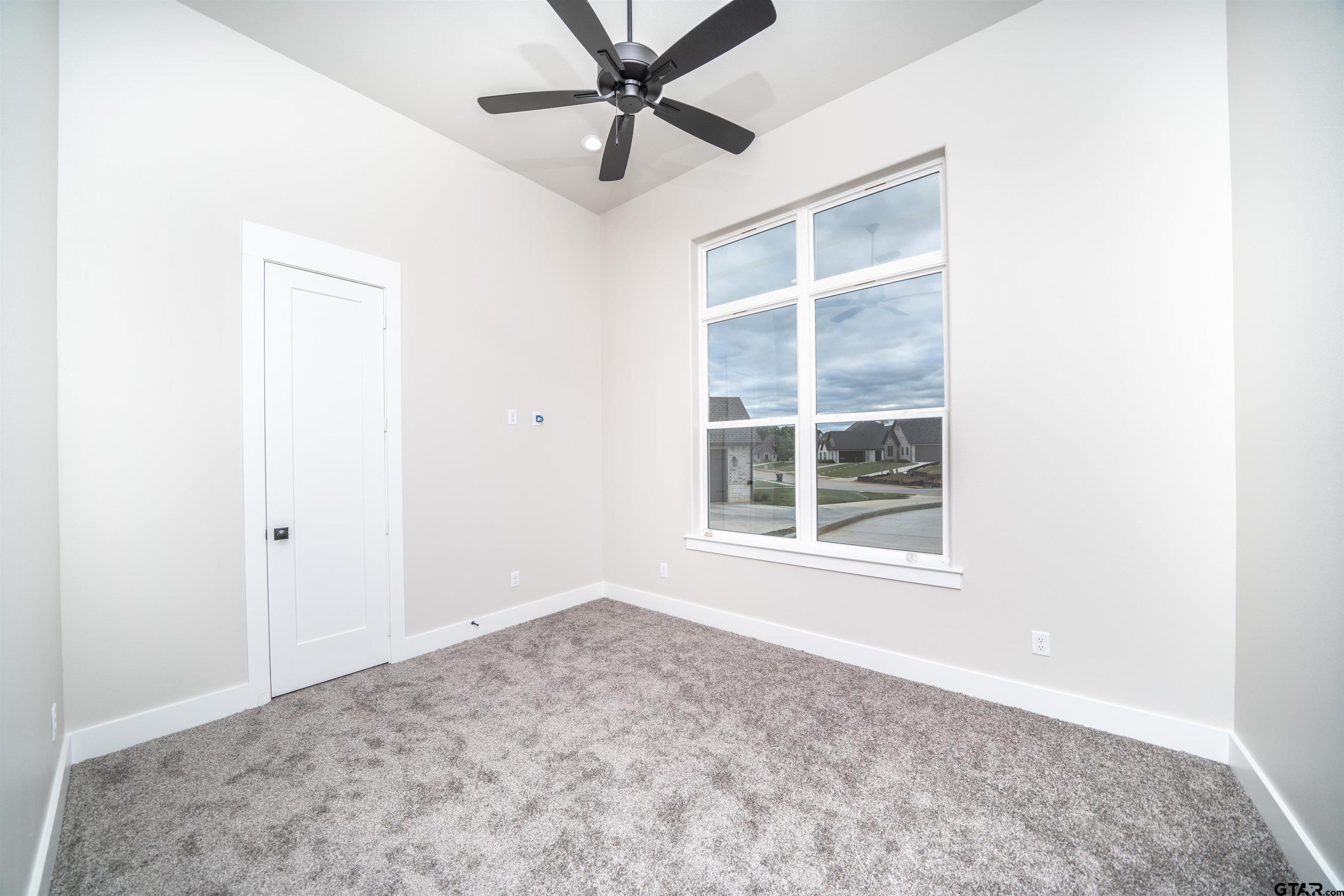 3910 Hidden Hills Circle Longview, TX 75605 - Photo 22 of 39 a view of an empty room with a window