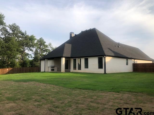 3910 Hidden Hills Circle Longview, TX 75605 - Photo 31 of 39 a house that has a big yard with potted plants
