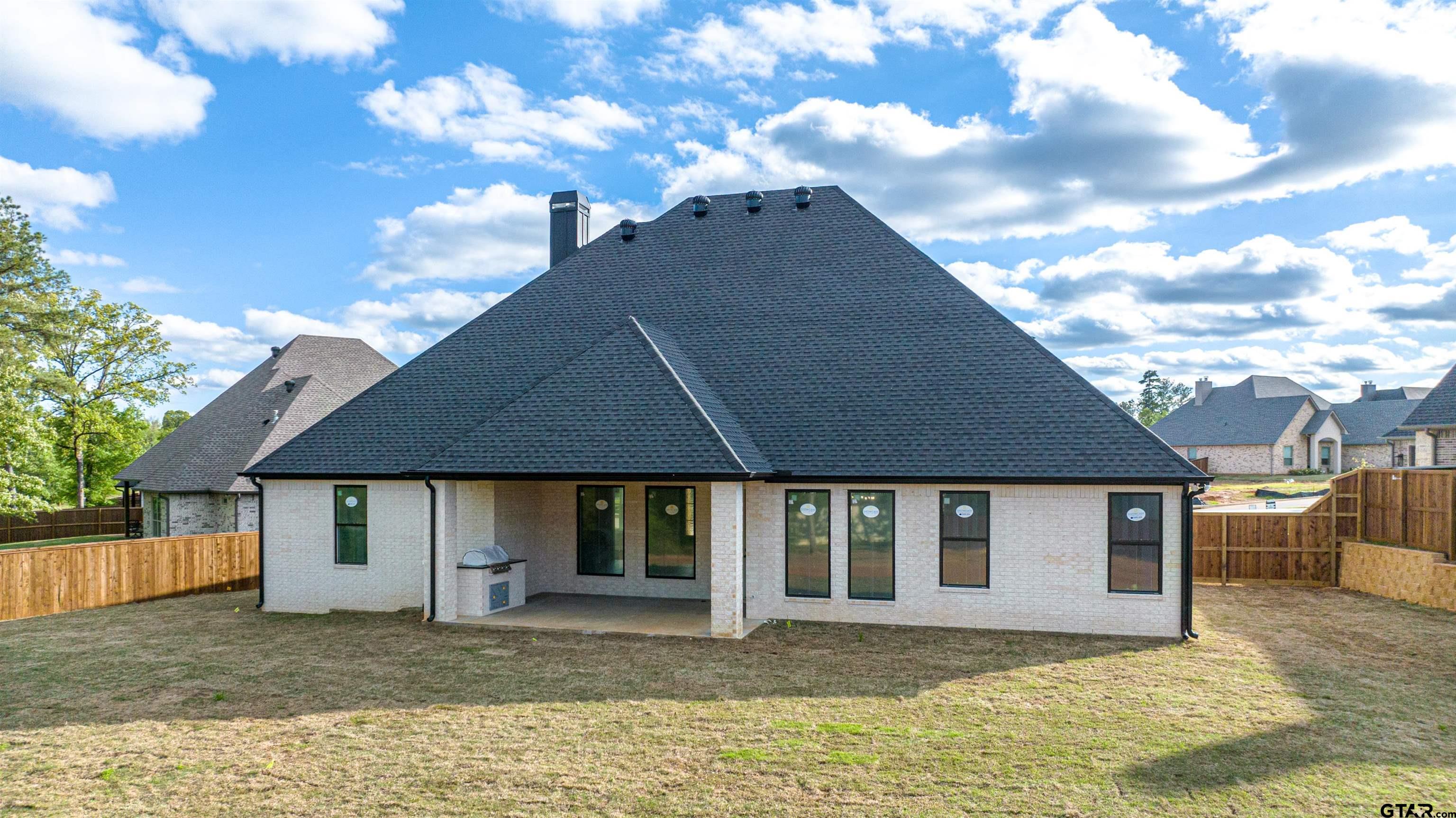 3910 Hidden Hills Circle Longview, TX 75605 - Photo 34 of 39 a house view with a garden space
