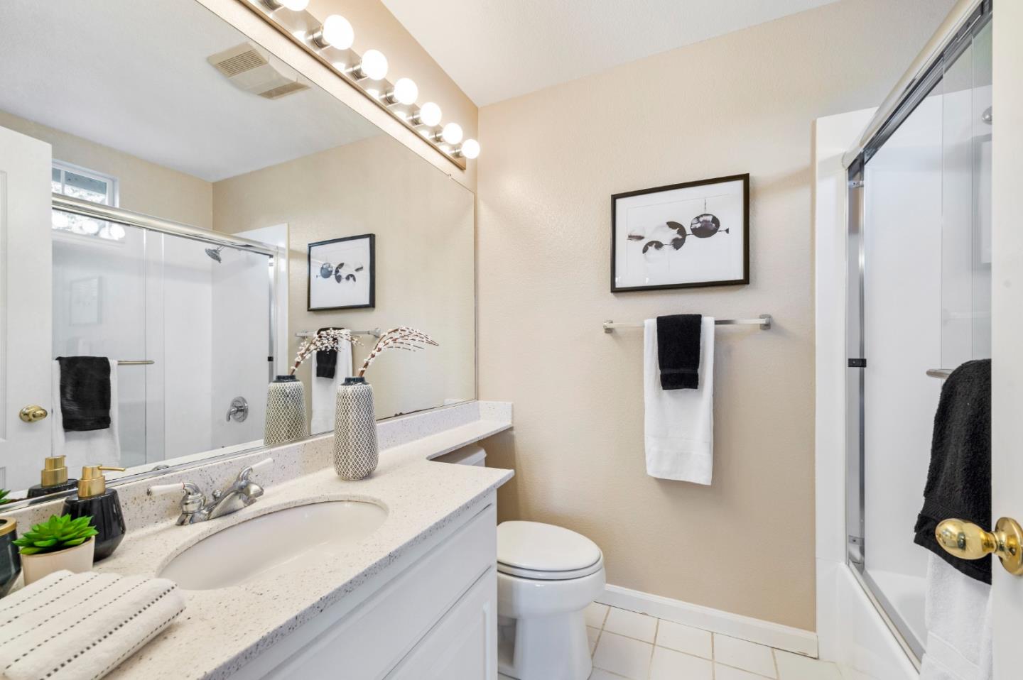 274 Primrose Drive San Jose, CA 95123 - Photo 21 of 30 a bathroom with a granite countertop sink mirror vanity and toilet