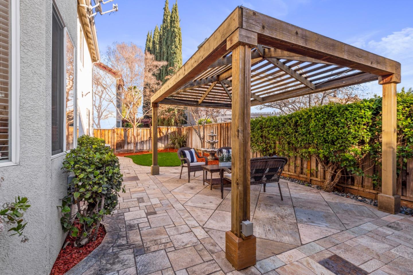 274 Primrose Drive San Jose, CA 95123 - Photo 23 of 30 a backyard of a house with a fountain table and chairs