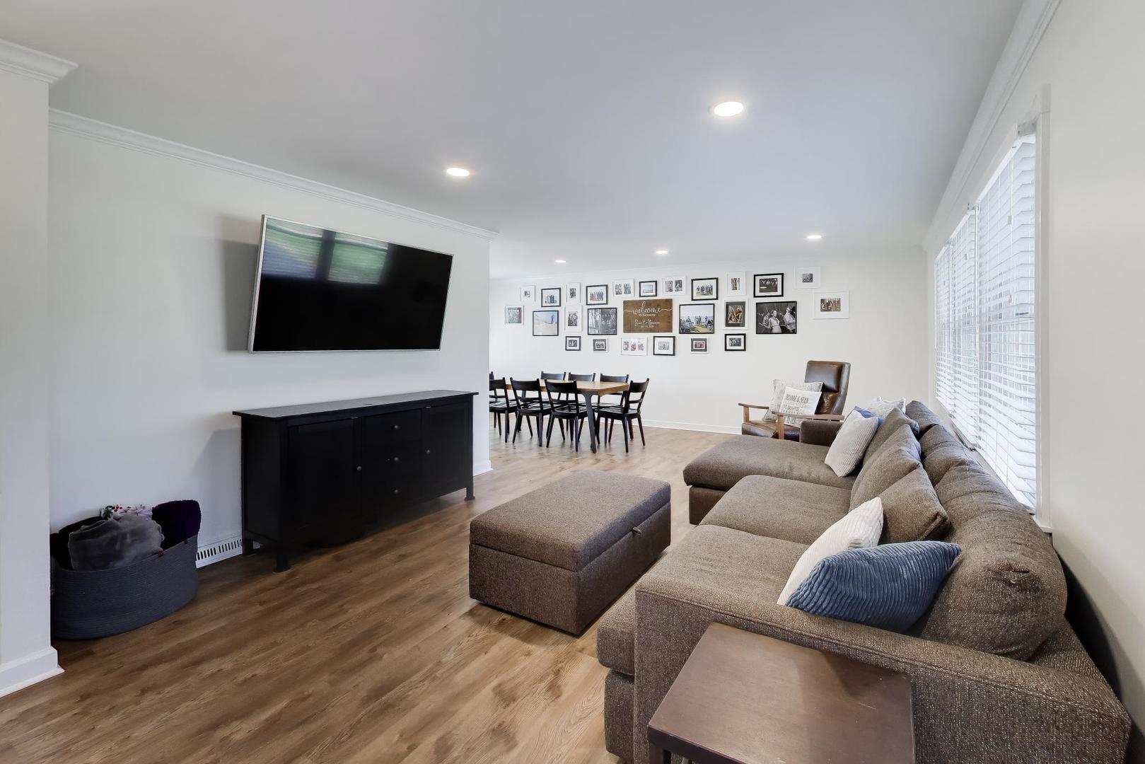 44 Swift Lane Naperville, IL 60565 - Photo 2 of 37 a living room with furniture and a flat screen tv