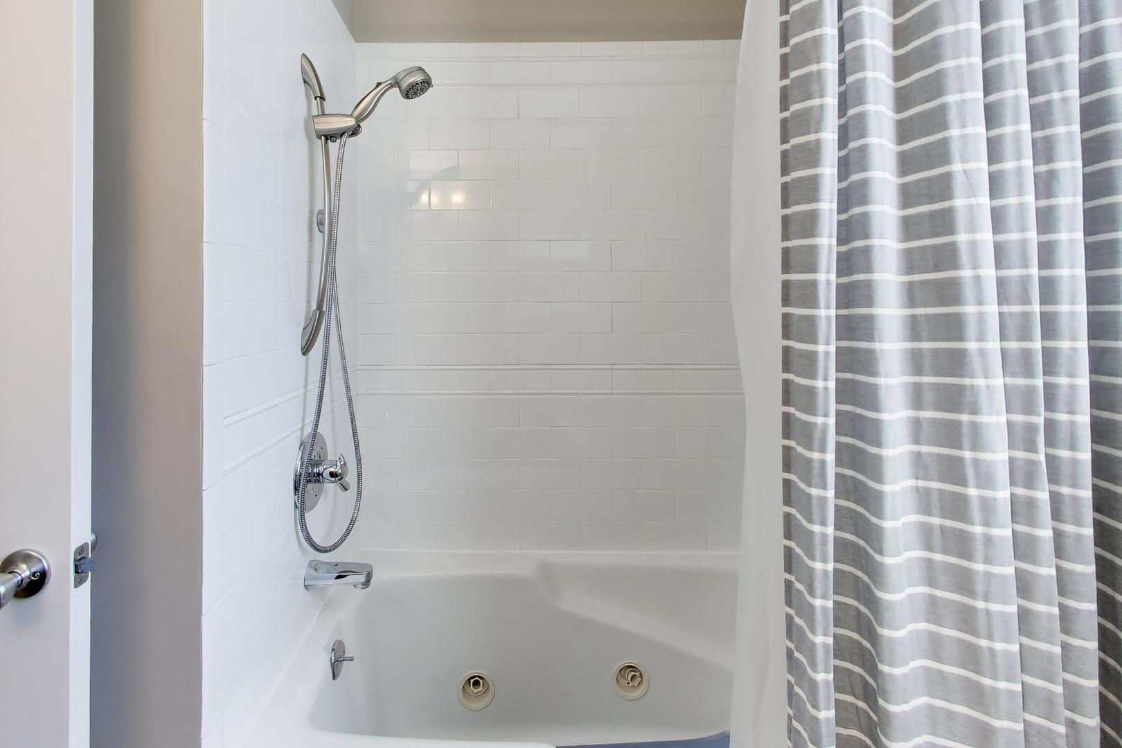 44 Swift Lane Naperville, IL 60565 - Photo 21 of 37 a bathroom with a shower and a bathtub